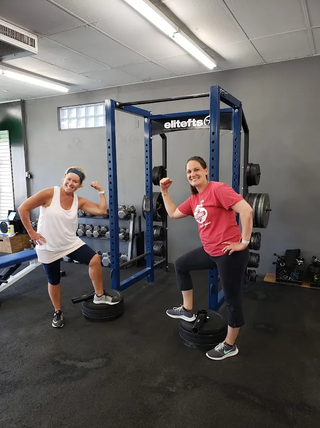 Members building strength at the power rack