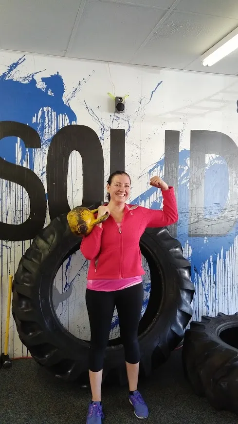 Solid Training member celebrating a personal training win